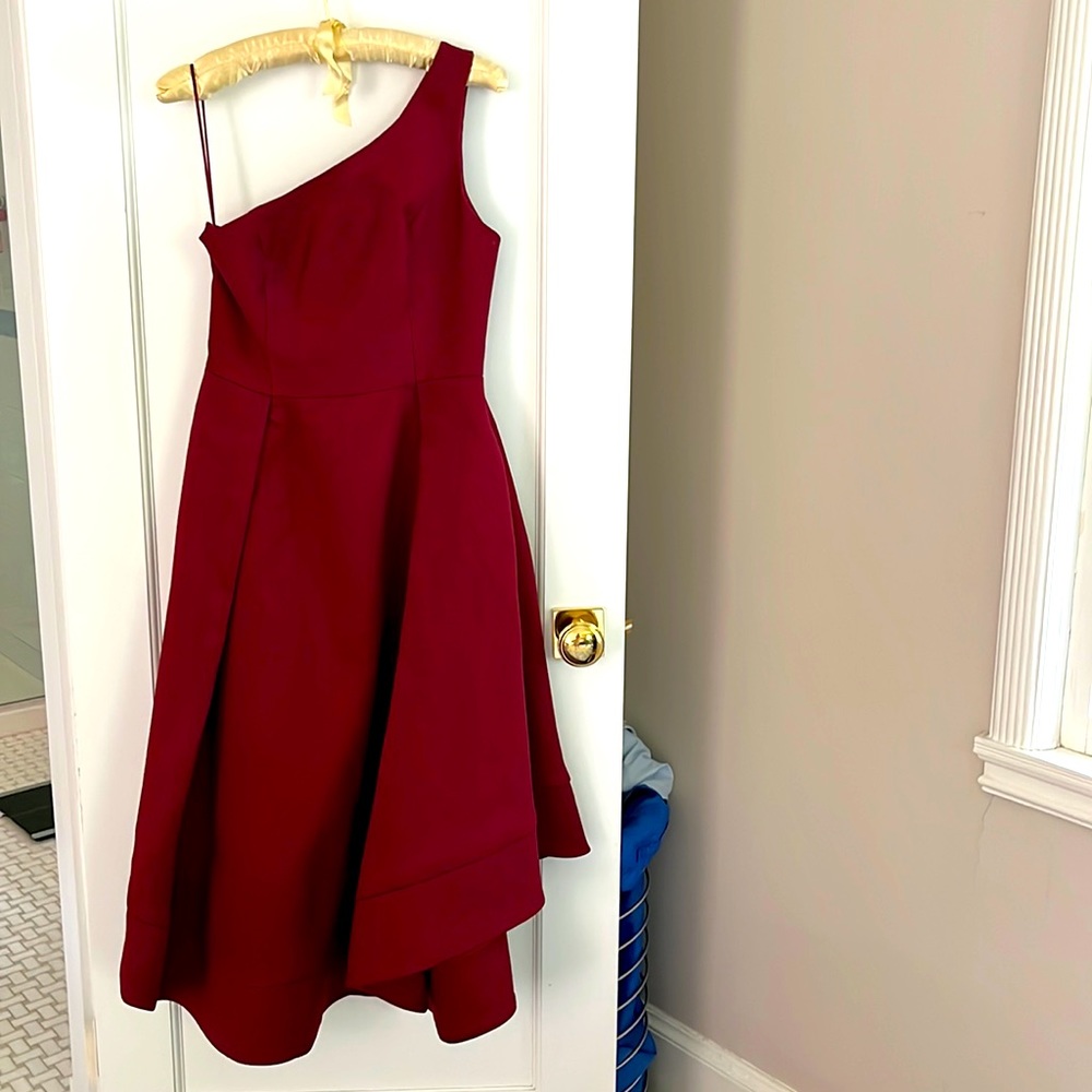 Red one shoulder gown with pockets. Never worn, perfect condition